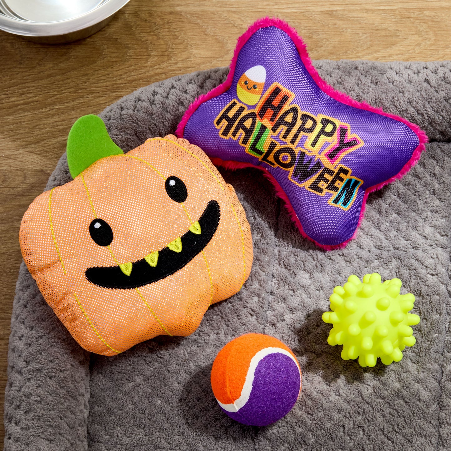 Halloween Dog Toys, 4 Piece Multipack, Orange Plush Pumpkin, Purple Squeaky Bone, Multicolored Tennis Ball, Yellow Spiky Ball
