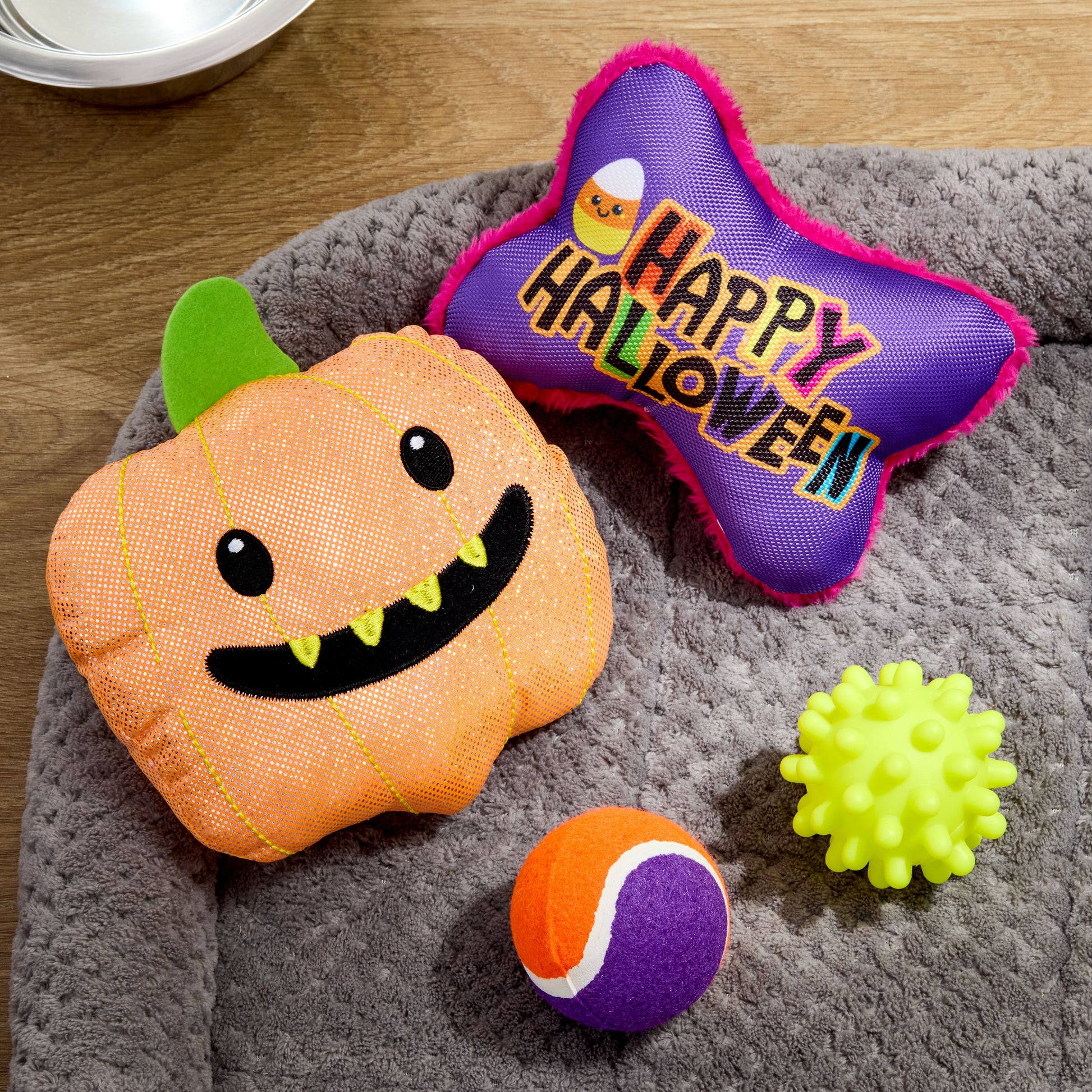 Halloween Dog Toys, 4 Piece Multipack, Orange Plush Pumpkin, Purple Squeaky Bone, Multicolored Tennis Ball, Yellow Spiky Ball
